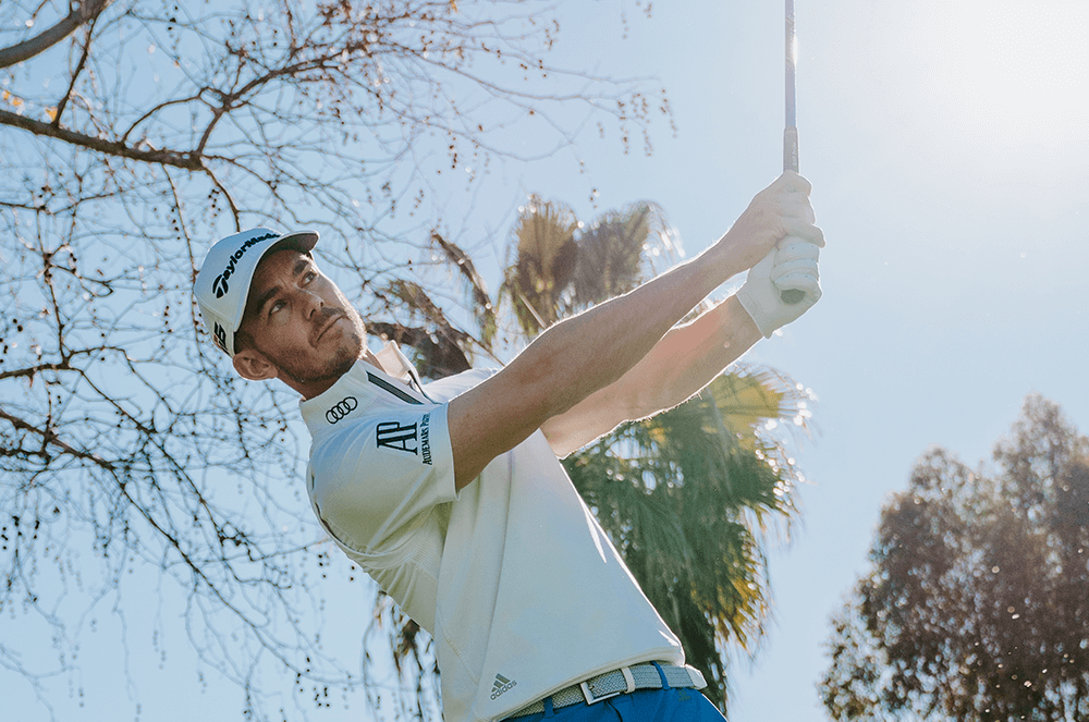 Man mid-swing with golf club