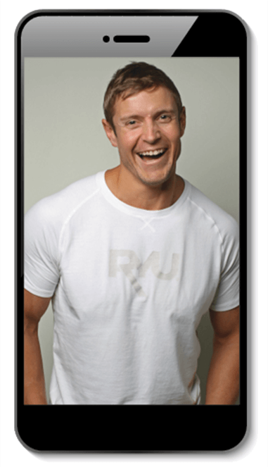 Man smiling and posing in white shirt