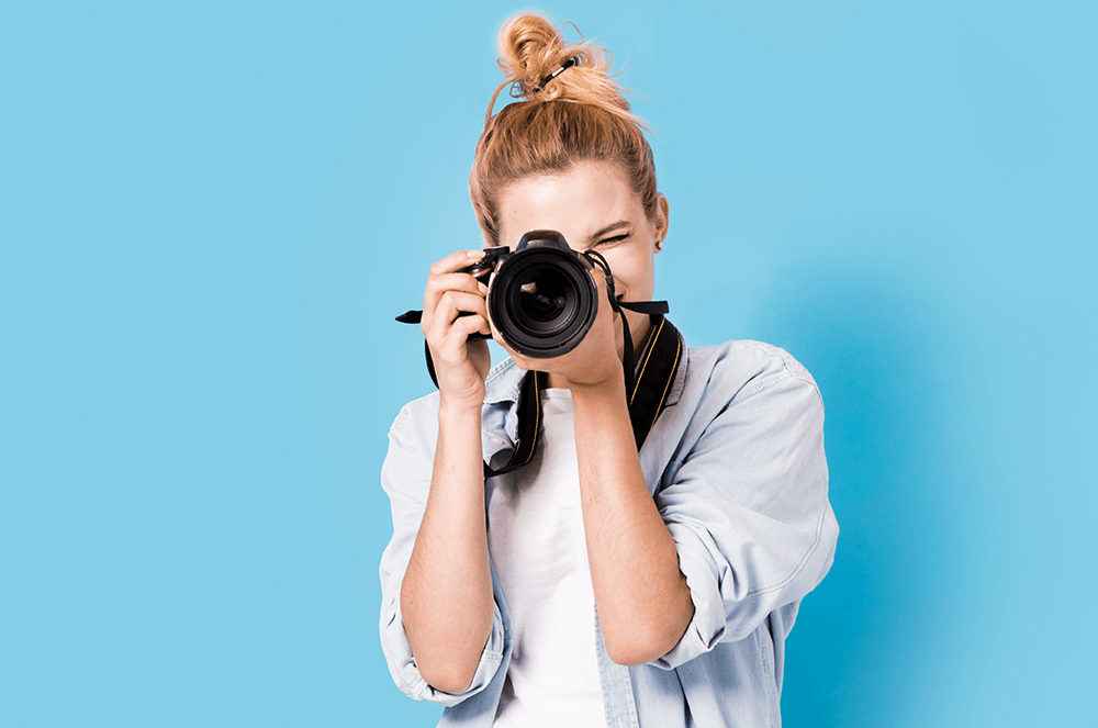 Woman taking photo with digital camera